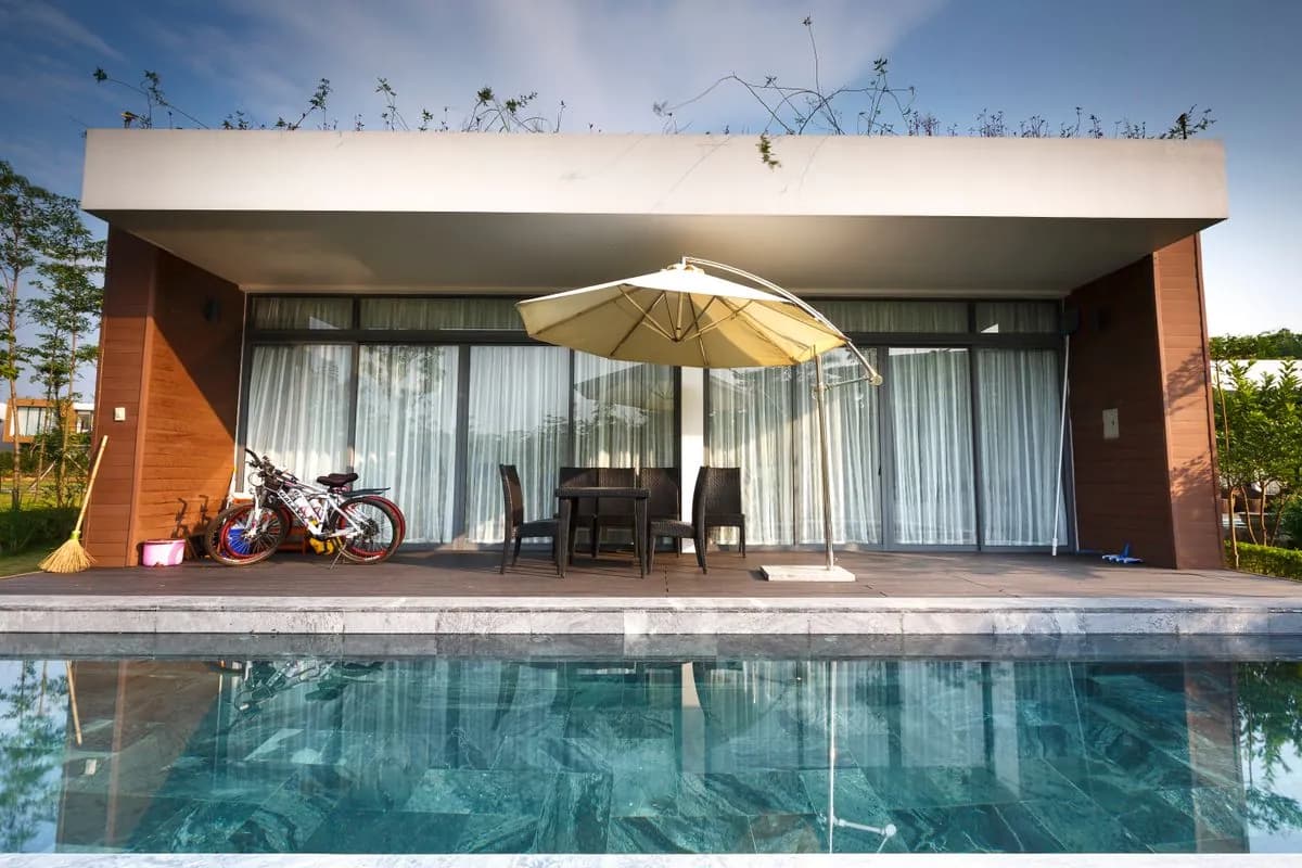 Modern villa pool with honed limestone coping and a porcelain deck in Dubai Hills Estate, Dubai