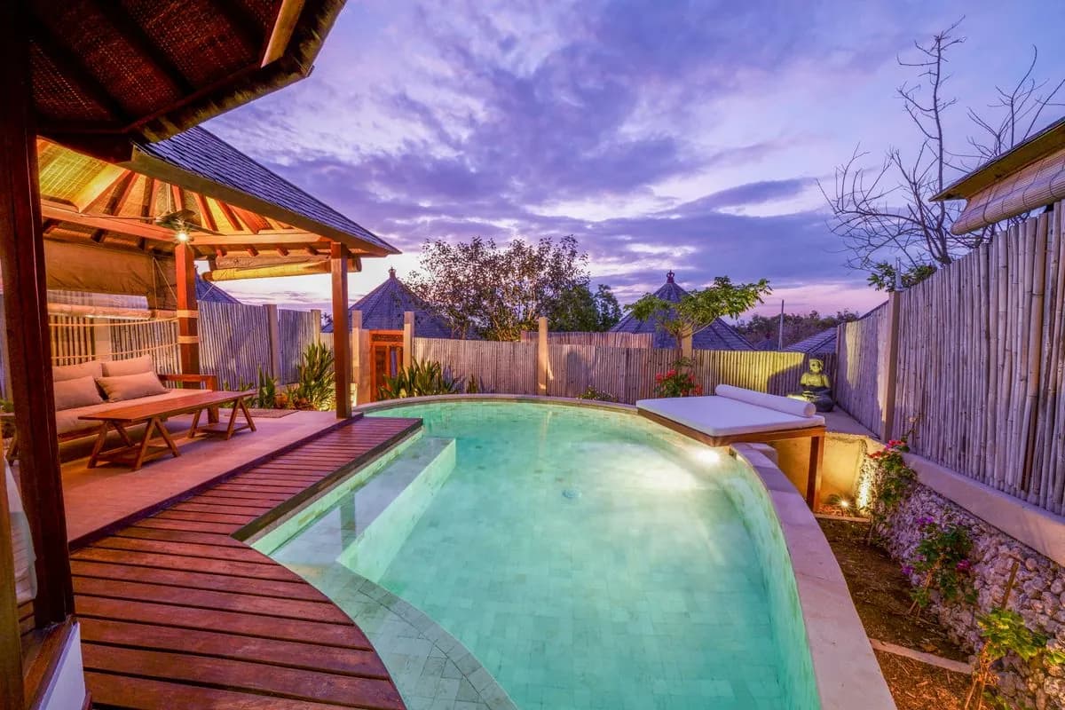 Villa pool deck at dusk with warm LED step and palm lighting, Palm Jumeirah, Dubai